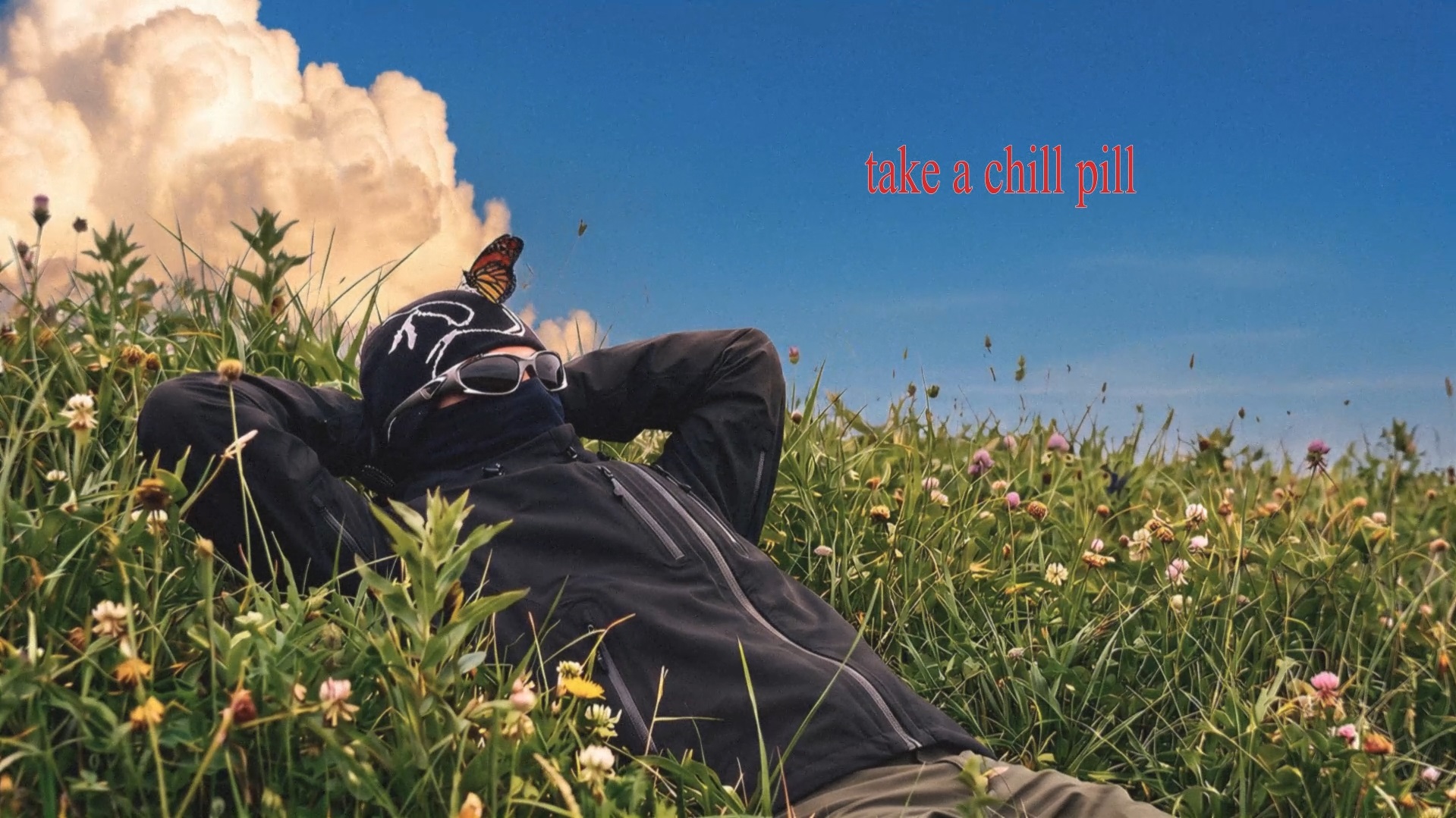 Masked figure lying in a wildflower field, relaxed, sunlit clouds behind